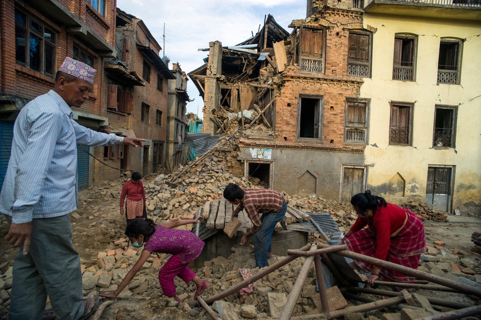 Bhupendra Man Shrestha, 51, and his family excavate the ruins of their collapsed home in Sankhu village, in Nepal's Kathmandu Valley.