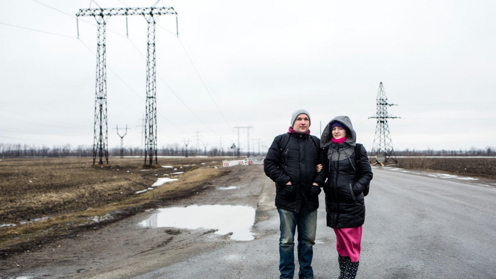 Sasha and Yulia near Mariinka checkpoint, on their way to see family.