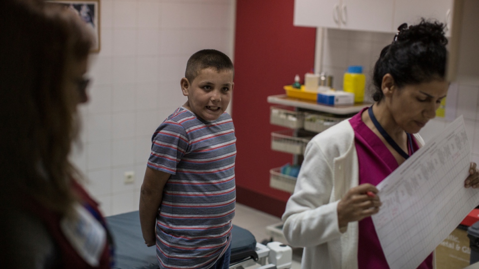 Mohamed  waits to get his height and weight checked at the Sacre Coeur Hospital in Hazmieh.
