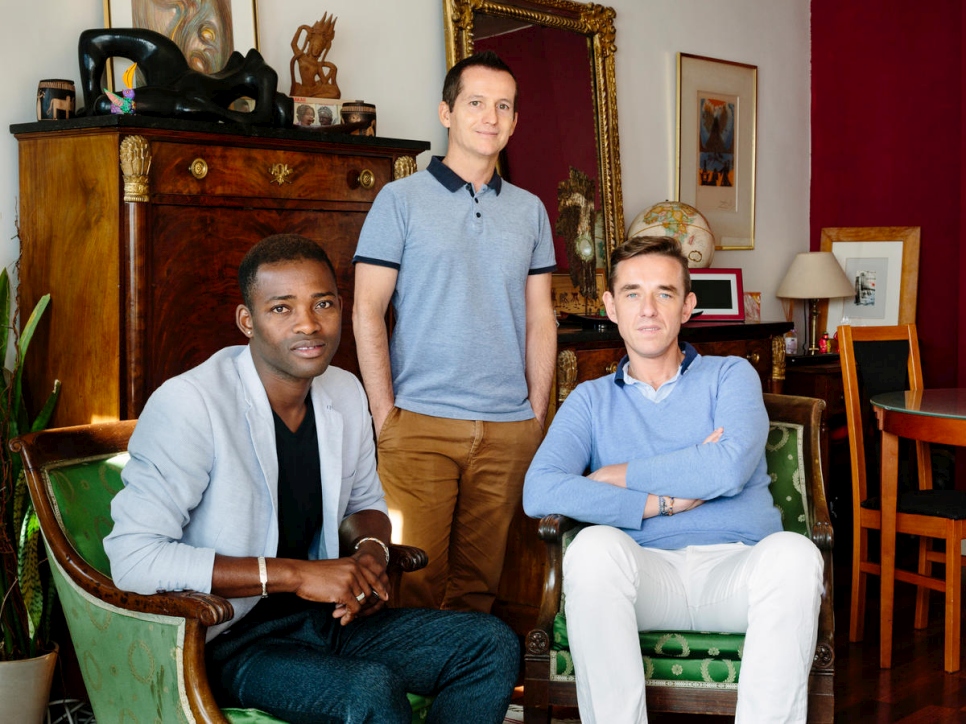 Christophe and Armand host Louis (left), a refugee from Mali, in their one bedroom apartment in Paris. Louis was persecuted because of his sexuality and his activities in the LGBT community.