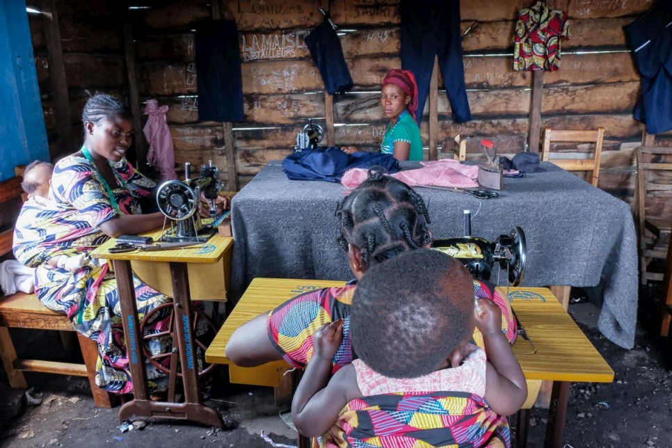 Formerly displaced women attend a tailoring class in Rusayo, DRC under the UNHCR reintegration project.