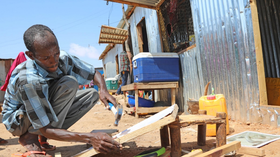 Mohamed 's newly acquired carpentry skills have allowed him to open his own business.