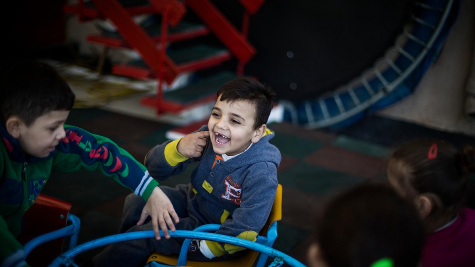 Mohammad, a young Syrian refugee from the ancient desert city of Palmyra, plays with classmates during a break at the Father Andeweg Institute for the Deaf (FAID) on the outskirts of Beirut in Lebanon.