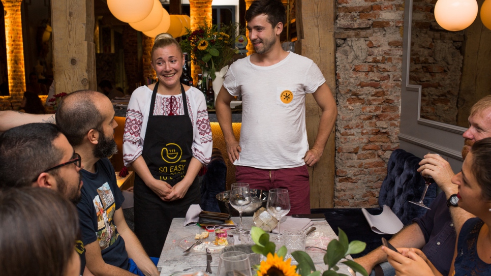 Refugee chef Natalia from Ukraine meets diners at Restaurante Gigi in Madrid.