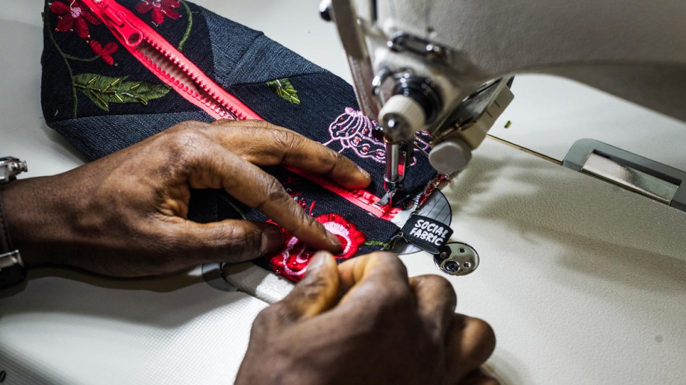 Cissé, a refugee from Côte d'Ivoire, worked as a tailor for 11 years at home. He now works part-time with Social Fabric.