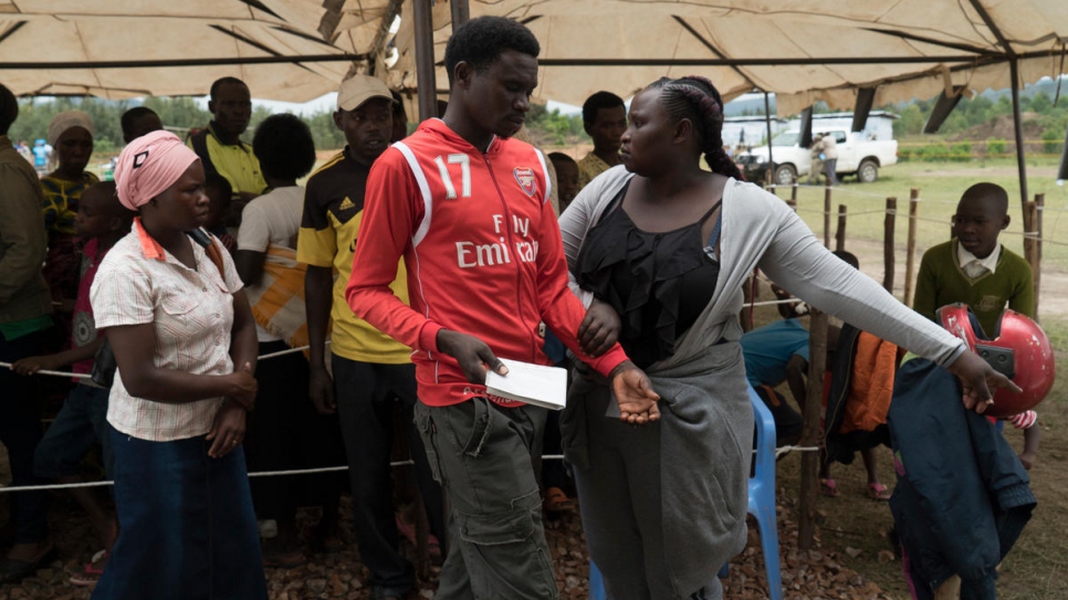 Jenipher helps to manage the crowd at the verification exercise.