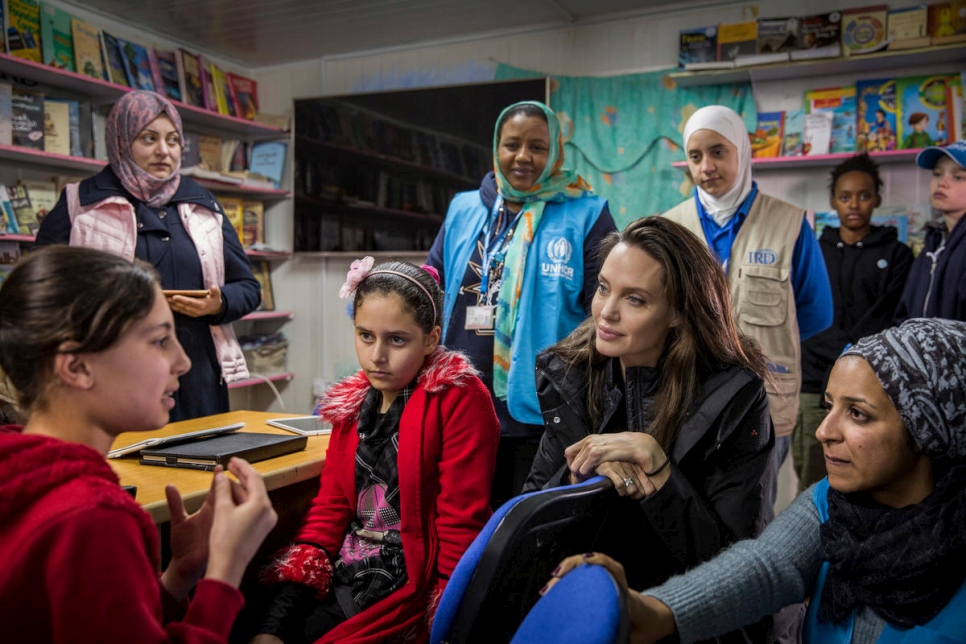 UNHCR Special Envoy Angelina Jolie talks to Syrian children at Za'atari camp in Jordan.