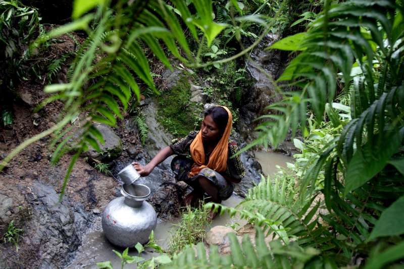 The absence of water outlets and proper sanitation means that Rohingyas living at the Teknaf site must collect water from a spring on a nearby hill.