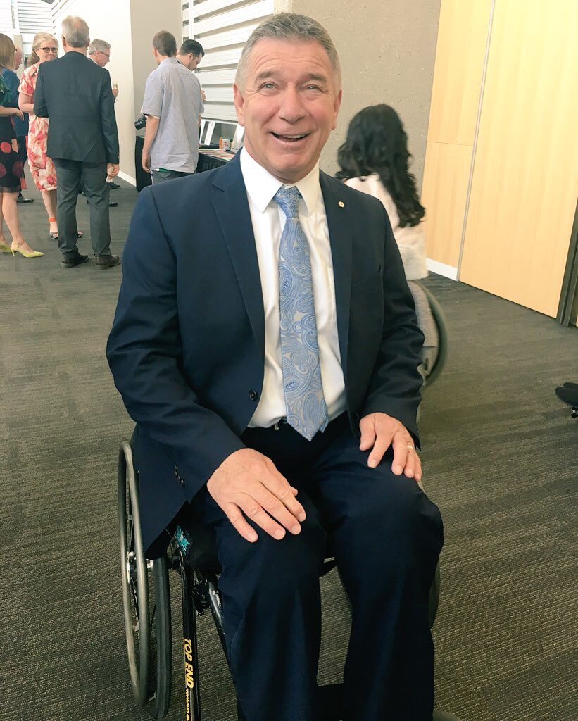 Rick Hansen smiles for a photo