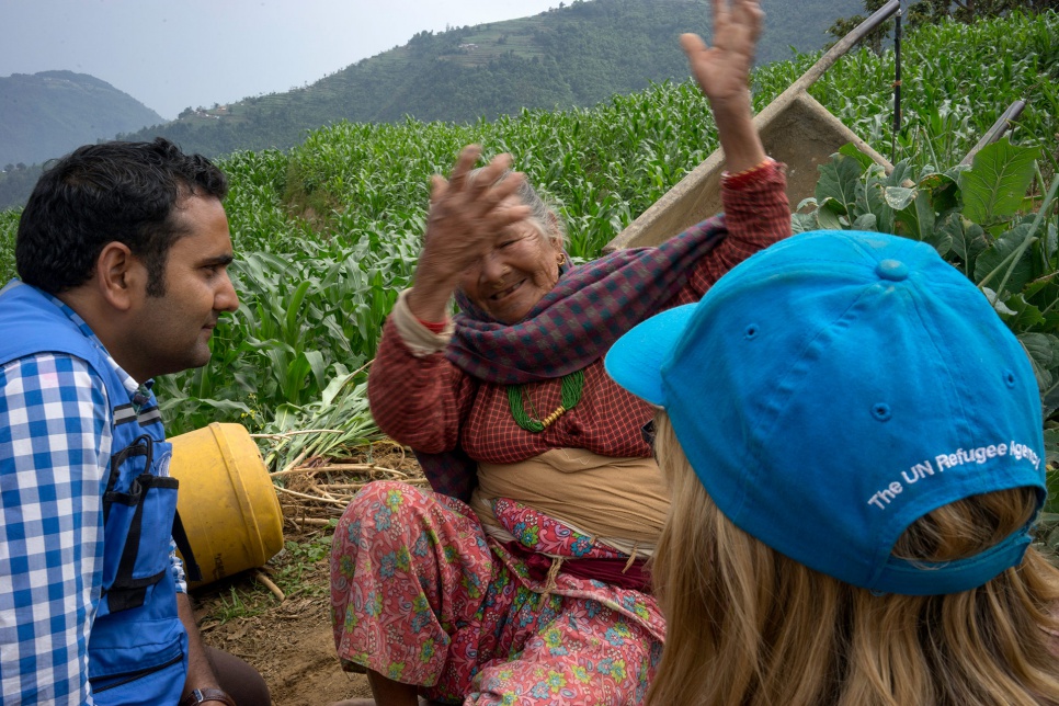 Antari Maya Jimba describes the April earthquake to aid workers who have come to the village of Jhankridanda, in the Lalitpur District of central Nepal.