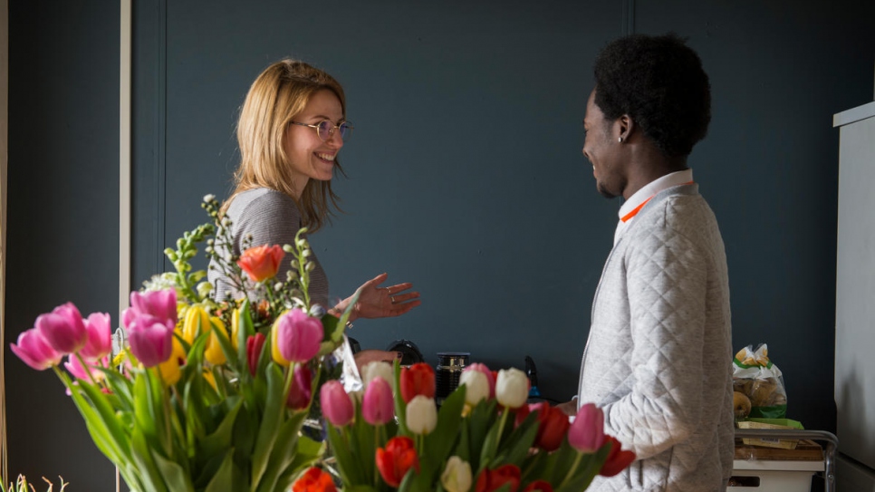 Dutch resident Amber Borra, who moved into a shared apartment at Startblok to escape overcrowded student accommodation, where she met Jamaican refugee Adrian.