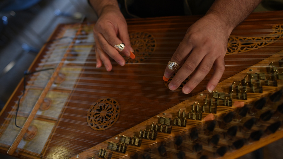 Maemon Rahal, from Syria, plays the qanûn instrument with the Orpheus XXI Orchestra in Arc-et-Senans, France.