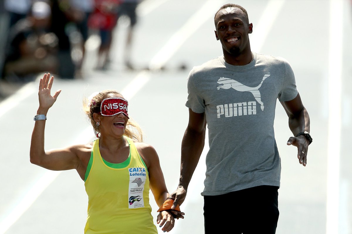 Usain Bolt running as guide for blind runner Terezina Guilhermina. United by.