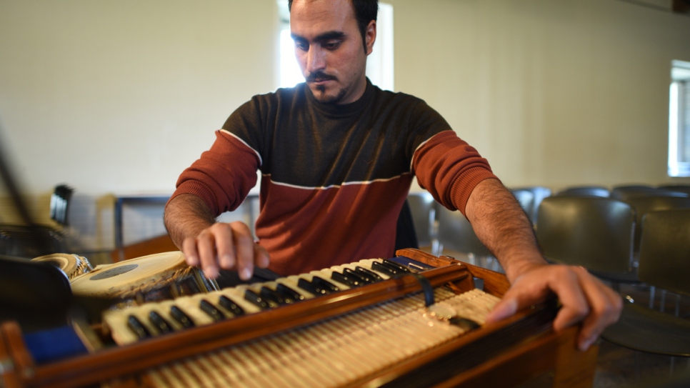 Walid Rafi, from Afghanistan, plays the tabla and harmonium with the Orpheus XXI orchestra at the UNESCO-listed Royal Saltworks cultural venue.