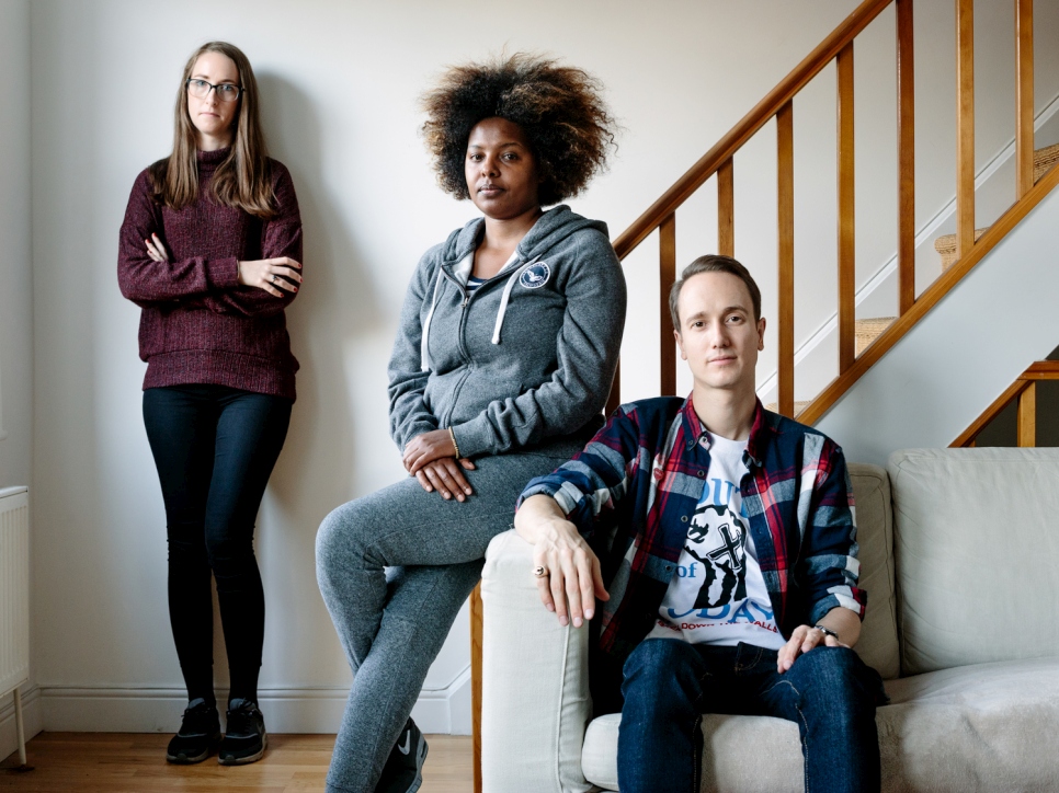 United Kingdom. Sudanese graduate finds a welcoming environment with London couple. This portrait is part of Great British Welcome, the UK chapter of the ongoing No Stranger Place series, which portrays locals and refugees living together in different countries.