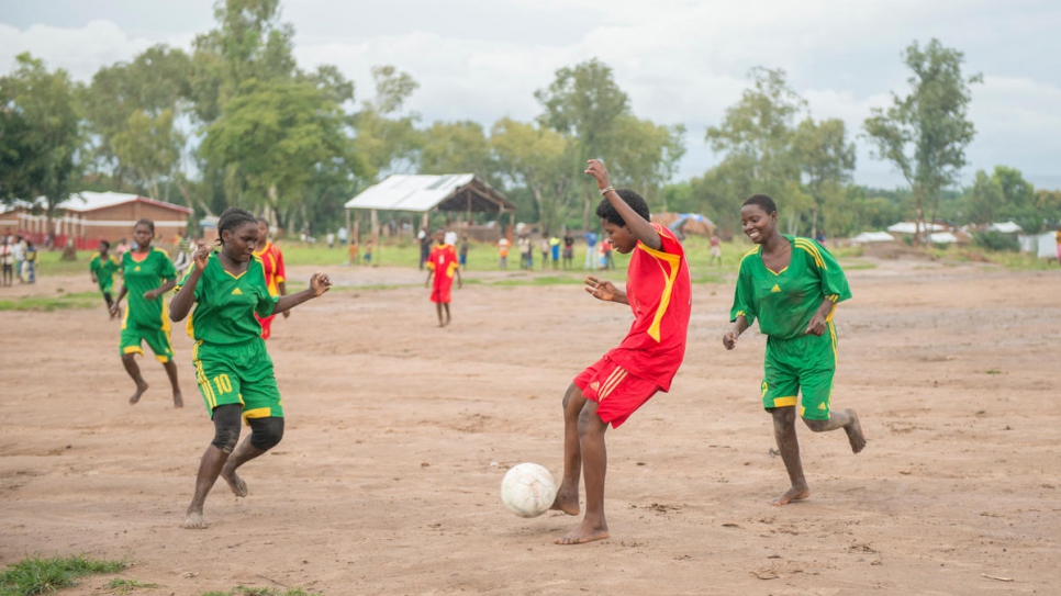 Morning Stars captain Emerance fends off her team's opponents in a match at Lusenda refugee camp.
