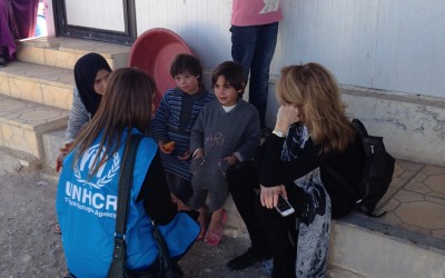 Listening to refugee children telling UNHCR about their day in Nizip camp