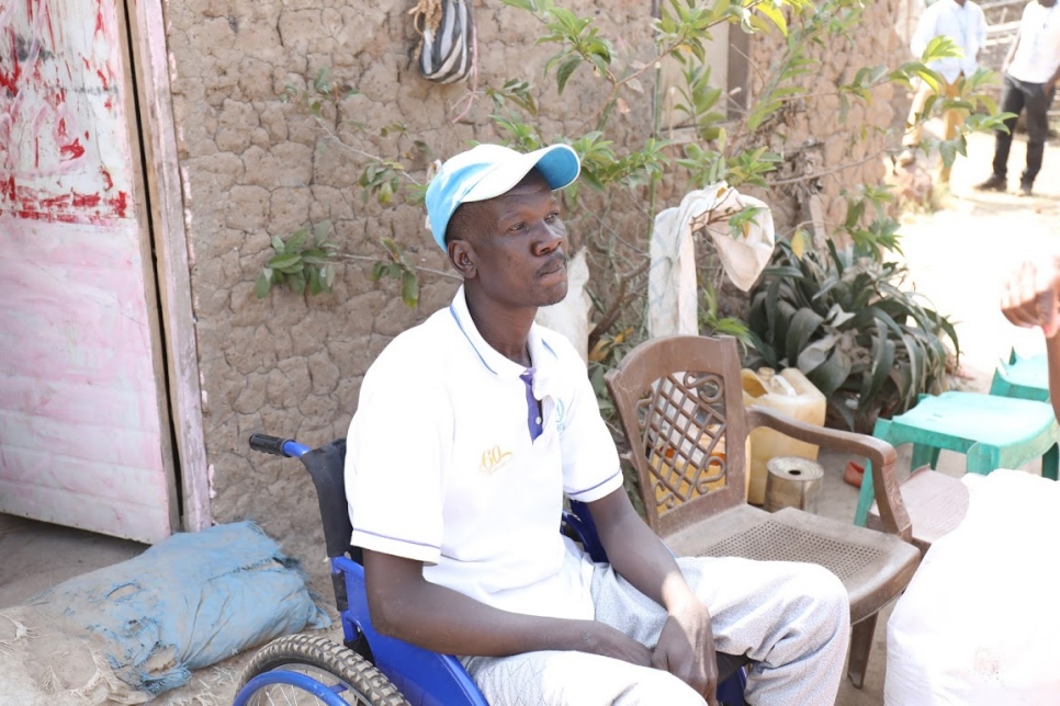 Zaki,43, sits outside his father's house in Wau, South Sudan. 