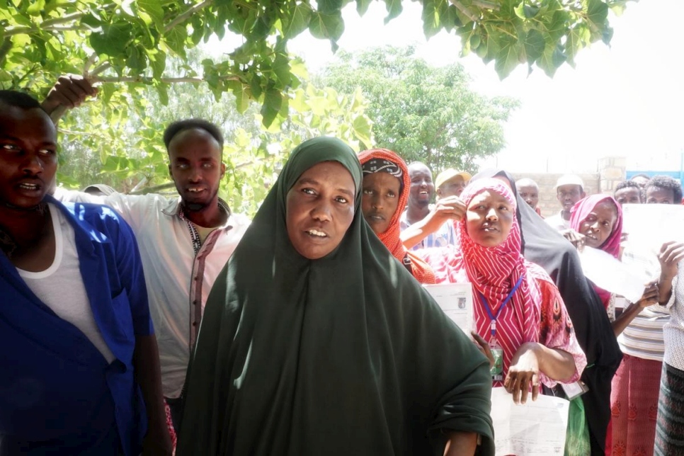 Fadumo Mohamed Ali queues with other refugees as they wait to receive their cash vouchers. The CBI project here has assisted over 7,000 refugees.
