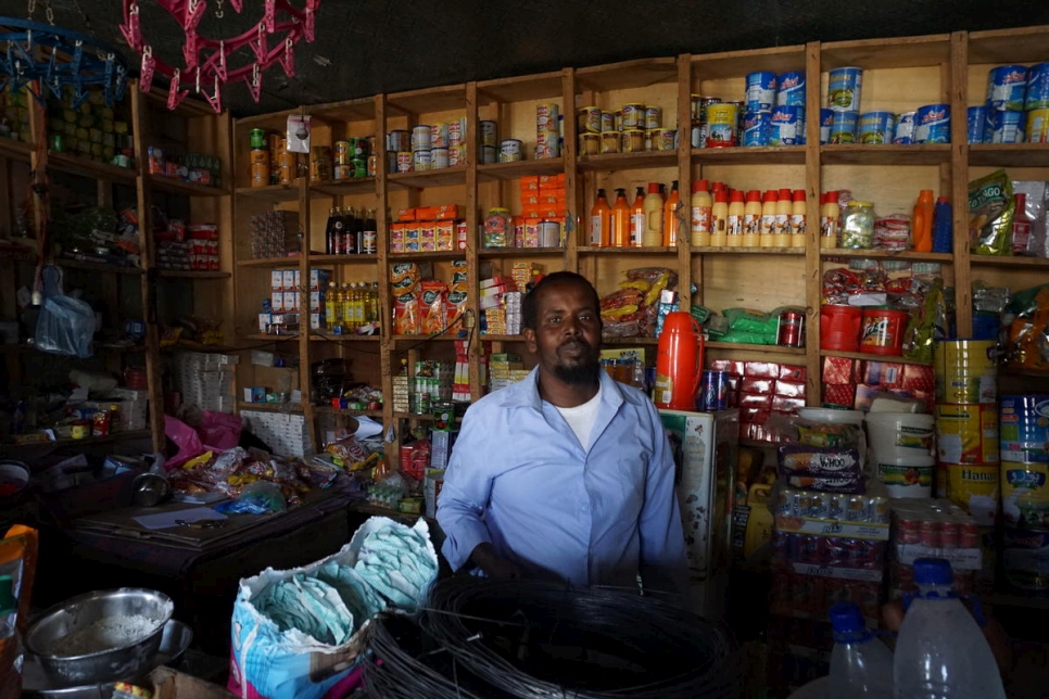 Local shop owner Abdullahi Aden Rooble from Sheder town, Ethiopia, sees the benefits of the cash assistance to refugees. 
