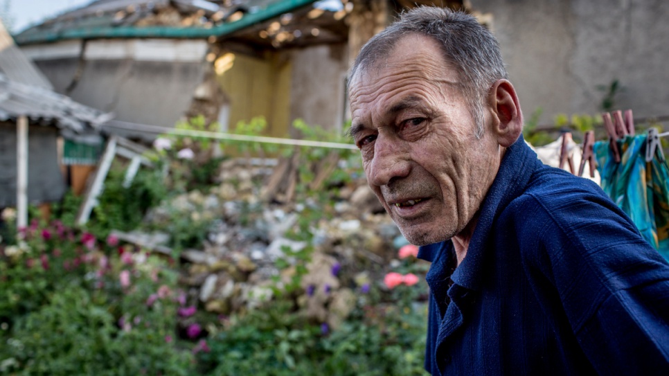 Vladimir Garmash, 66, outside the ruins of his home in eastern Ukraine.