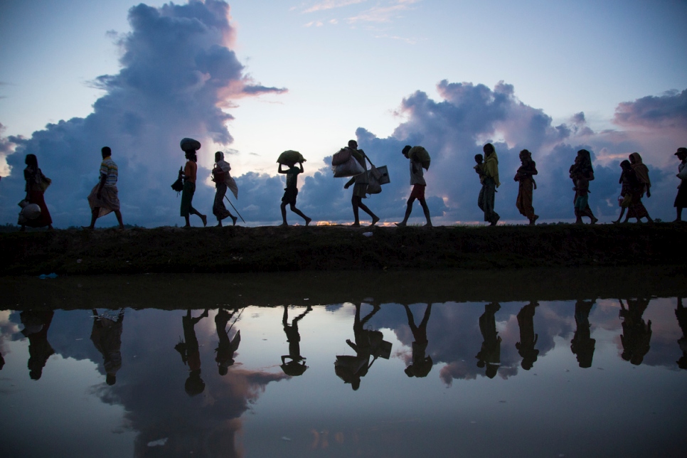 Thousands of new Rohingya refugee arrivals cross the border near Anzuman Para village, Palong Khali, Bangladesh.