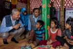 High Commissioner for Refugees, Filippo Grandi (left) talks with Rohin...
