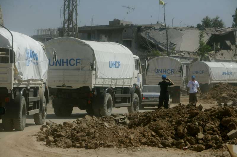A UNHCR convoy carrying emergency tents, mattresses and blankets, arrives in the southern Lebanese town of Siddiqine.