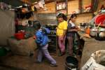 An indigenous family's shelter in Los Altos de Cazucá. Displacement deals a double blow to indigenous people - not only do they endure the trauma of being forced out of their ancestral lands, but their flight to safety also means losing contact with their tribe, language, and customs.