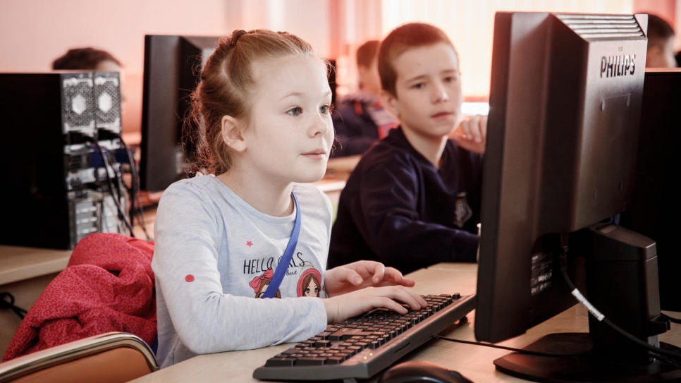 Nine-year-old Masha from Ukraine designs a game in one of the classes.