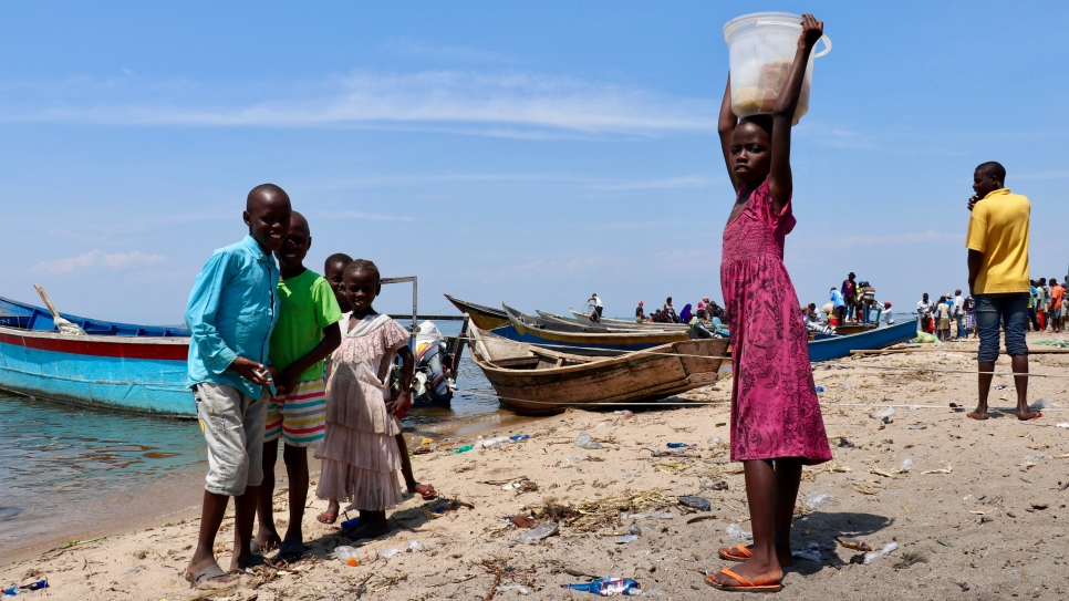 Children play on the shores of Lake Albert in Tchomia, Ituri province, where thousands of Congolese refugees who fled to Uganda have returned.