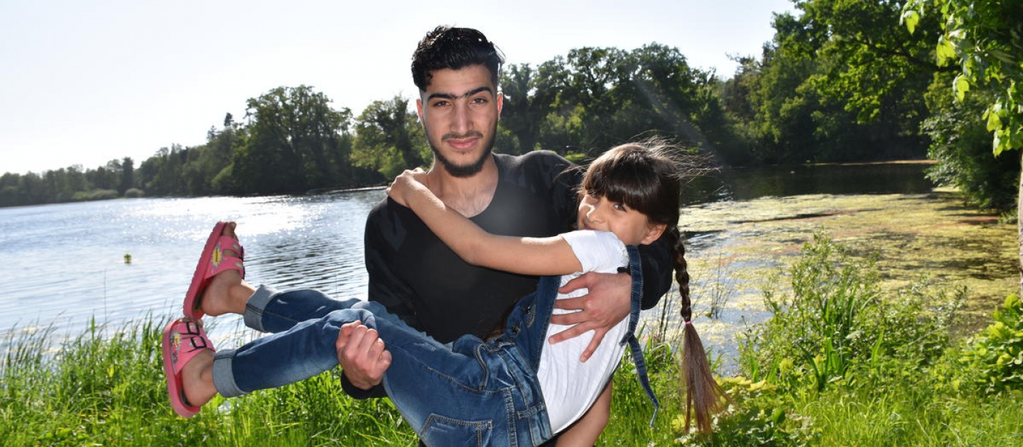 Refugee from Syria hugs his sister in Lensahn, northern Germany