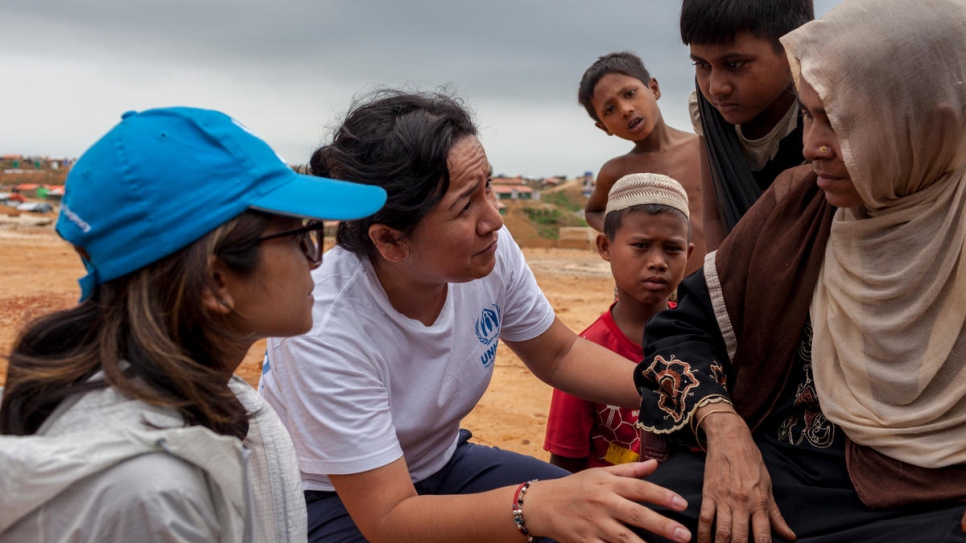 UNHCR workers Sarah Jabin (left) and Jacqueline Julca (right) help to relocate refugees in Bangladesh.