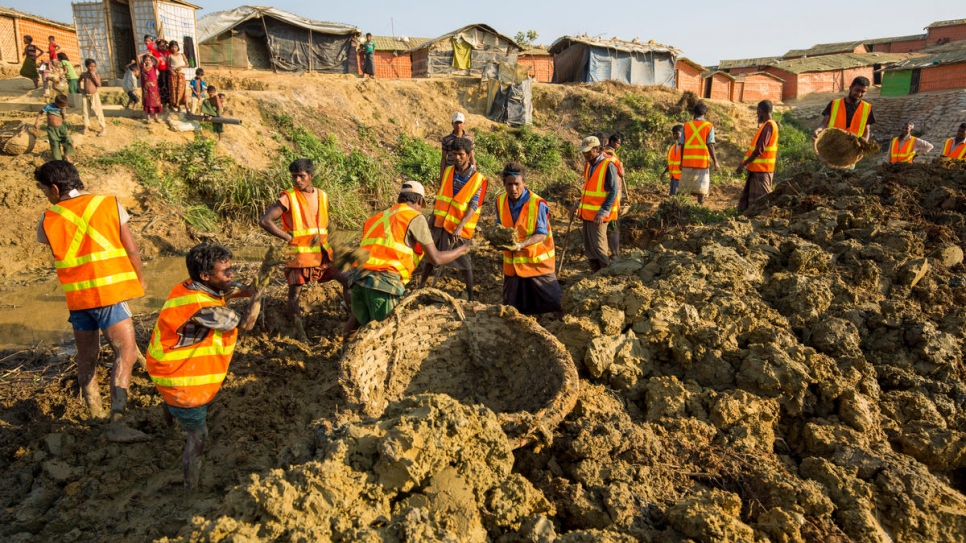 UNHCR starts work on the Site Maintenance Engineering Project, a joint initiative with the IOM and WFP to make Kutupalong camp safer for thousands of Rohingya refugees.