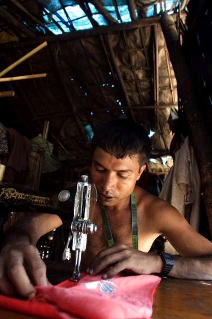 Income generation programmes provide many Rohingyas with the skills and means to start a small business. Here, a tailor makes clothes in Nayapara camp, one of the two government-run camps in Cox's Bazar.