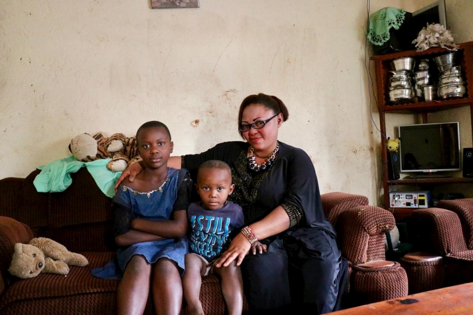 Woman with two boys sitting