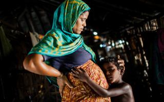 Nur Nahar, 30, with her middle son. She is the wife of Rahamat Ullah, 35. They came to Bangladesh together about fifteen years ago from Maungdaw, Sittwe, Myanmar to escape the violence and torture of the Myanmar Security forces.