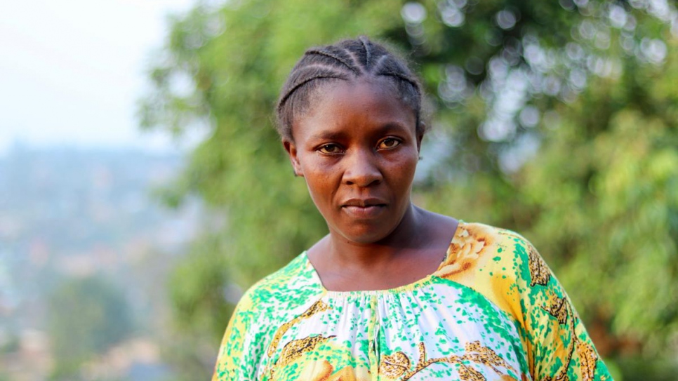 Bambou, 41, her husband and 12 children fled Bwili village, in Beni territory, a year ago. They live in the Madiabuana neighbourhood in Beni. They tried to return to Bwili four times since they fled. She hosts other displaced families on the plot of land she is renting.