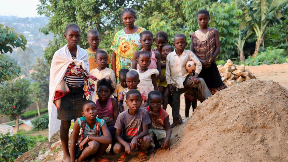 Bambou, 41, surrounded by her kids and the children of other displaced families she is hosting on the plot of land she rented in the Madiabuana neighbourhood of Beni.