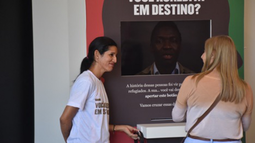 Francis, from Venezuela, working at an interactive kiosk called "I Am Refugee," during the São Paulo Biennial of Arts. 