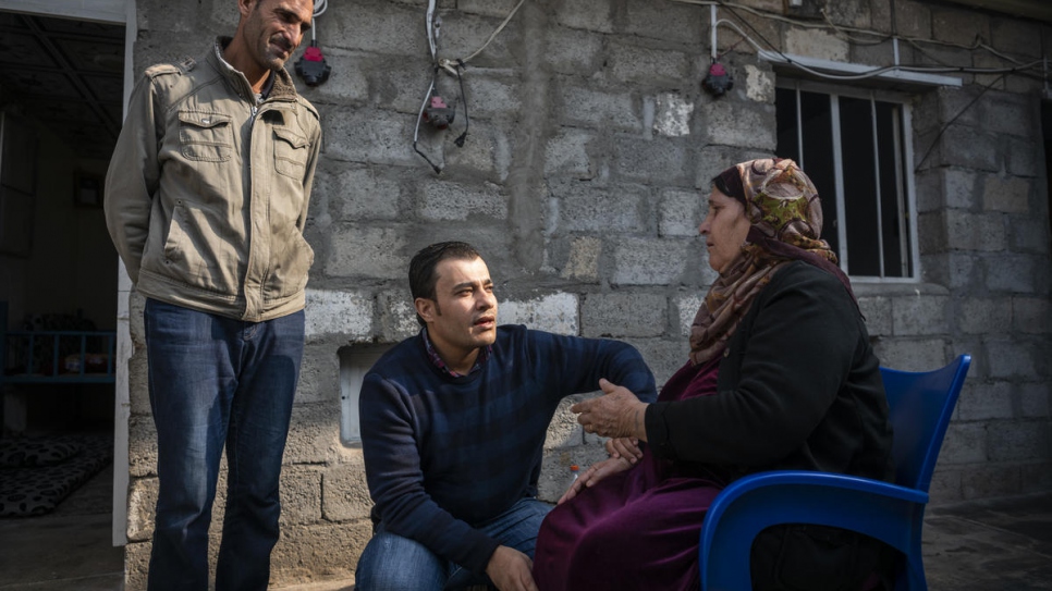 Dr. Mohammed Issa, 33, from Al-Hasakah  in northern Syria, visits a patient in Darashakran Camp, near the city of Erbil, capital of the Kurdistan Region of Iraq.