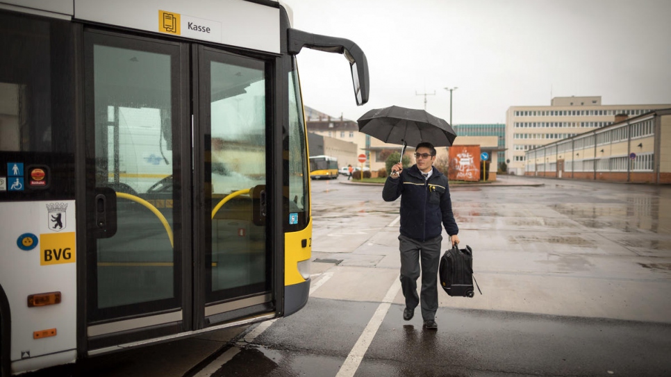 Mohamad arrives at the bus depot for his shift.