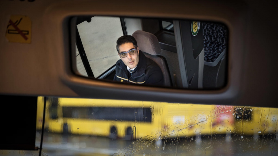 Mohamad is happy to be behind the wheel of his bus in Berlin. 