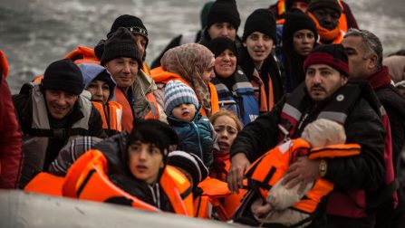 A boatload of refugees prepare to disembark from their boat that has crossed the short ribbon of sea between Turkey and Greece. ; Over one million refugees and migrants arrived in Europe by sea in 2015. An overwhelming majority were fleeing war and persecution. More than 80 percent of those who survived the crossing came from the world’s top refugee-producing countries.