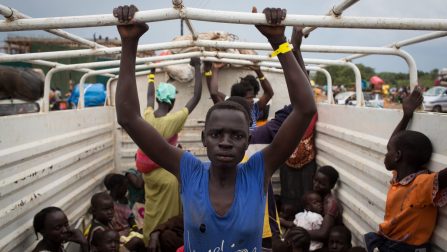 Refugees from South Sudan are transported from Elegu to the Numanzi Transit Centre in the Adjumani district of northern Uganda where meals and temporary accommodation are provided by UNHCR. ; More than 43,000 South Sudanese refugees crossed into Uganda between 7 July and 27 July 2016 following an outbreak of fighting in Juba between forces loyal to President Kiir and First Vice President Machar. At least 300 people were killed in the violence that erupted in the capital. The refugees came into Uganda via border crossing points at Moyo, Kuluba, Lamwo, Yumbe and Elegu and the numbers increased when government authorities opened the border into Uganda at Nimule and cleared the 200-kilometre Juba-Nimule road of checkpoints. Many refugees travelled on convoys of trucks, taking their belongings with them. Ninety per cent of the refugees are women and children. Many have arrived at the newly established Pagarinya 2 settlement in Adjumani District, northern Uganda, while others are waiting at collection points to be transferred to the settlement. UNHCR estimates that nearly one in four South Sudanese citizens are displaced within its borders or in neighbouring countries due to conflict and food shortages, and the total number of South Sudanese refugees could exceed 1 million this year.