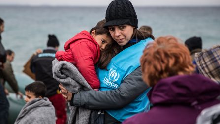 A UNHCR staff member comforts a young refugee boy after his boat landed on the Greek island of Lesvos. ; Over one million refugees and migrants arrived in Europe by sea in 2015. An overwhelming majority were fleeing war and persecution. More than 80 percent of those who survived the crossing came from the world’s top refugee-producing countries.