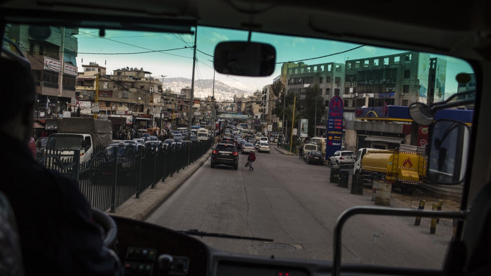 The streets of Beirut's Dahieh neighbourhood are seen through the windshield of the "Fun Bus".