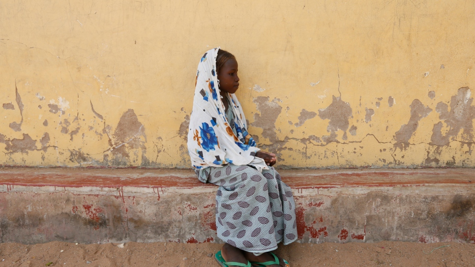 Eight-year-old unaccompanied minor Issa Aj sits alone in Fufore camp for internally displaced persons in Adamawa State, north-east Nigeria.