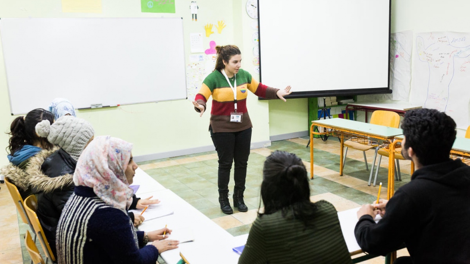 A teacher at the KEDU school talks to her students during class. 