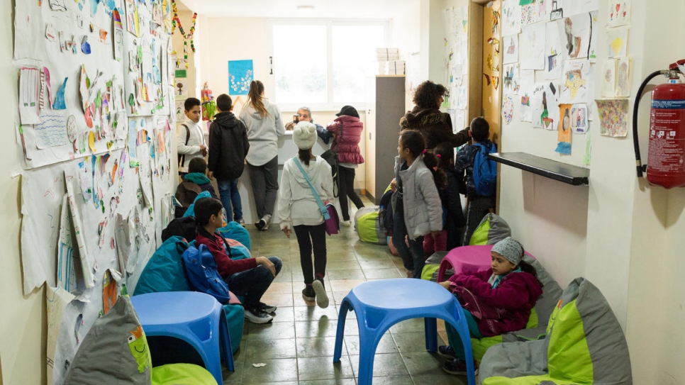 Students take a short break from classes at the KEDU school.